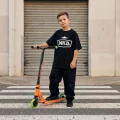 scooter_nkd_mini_gen_black_orange_lifestyle_7025.webp